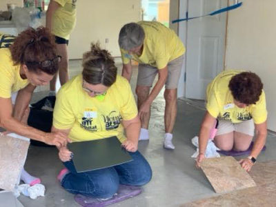 Estero Island Chapter, NSDAR, members  laying floors for Habitat for Humanity Women Build